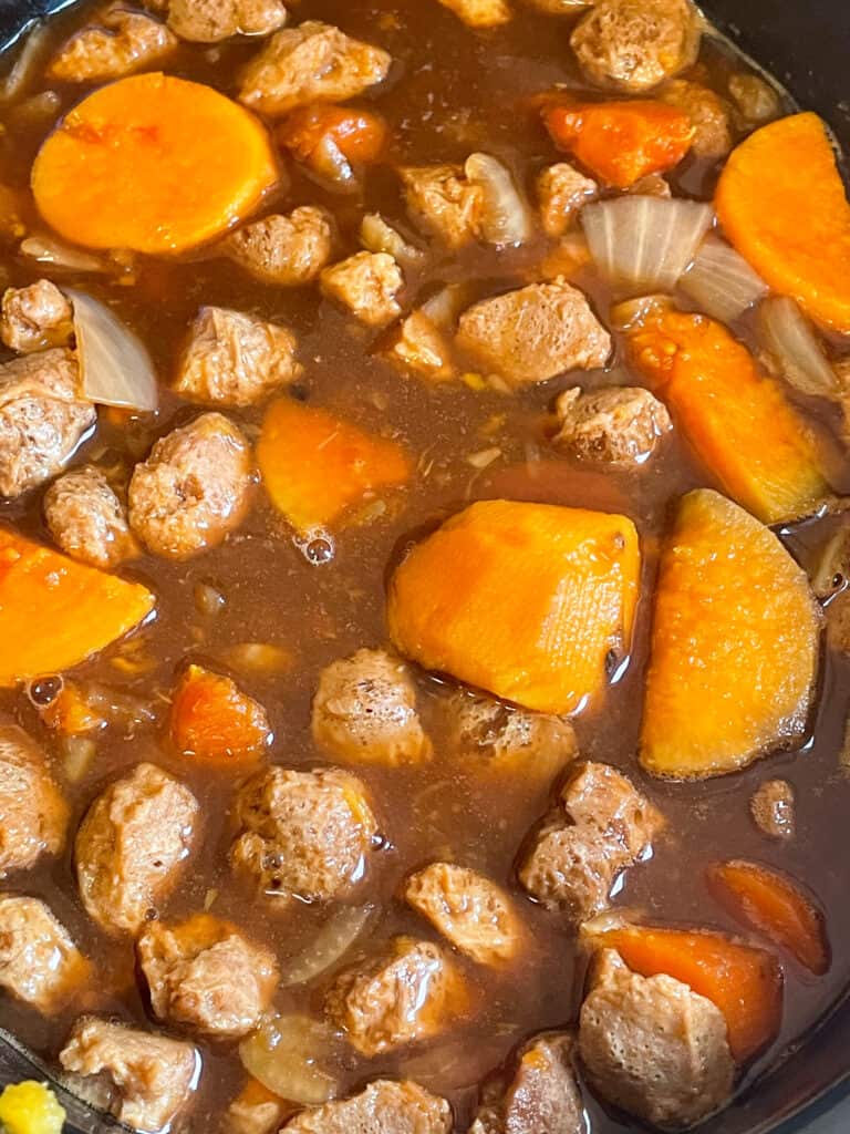 vegan beef stew cooking in slow cooker