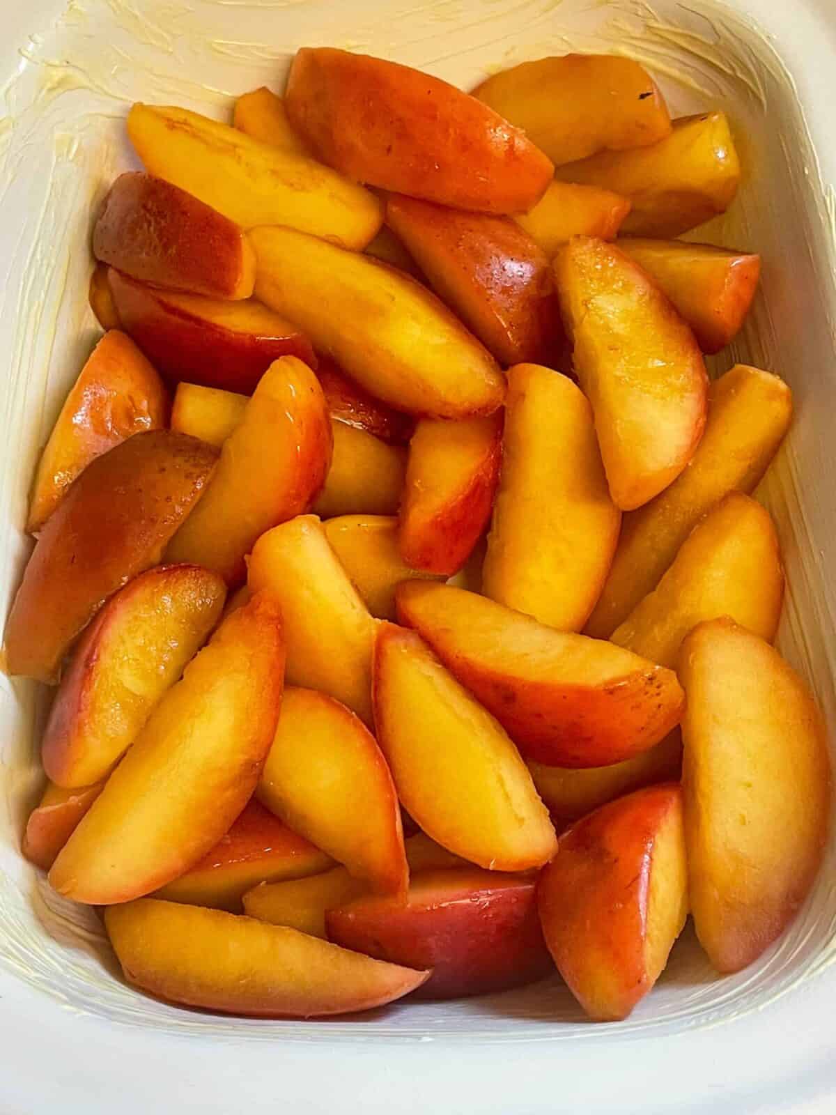 Apples stewed and added to the baking dish.
