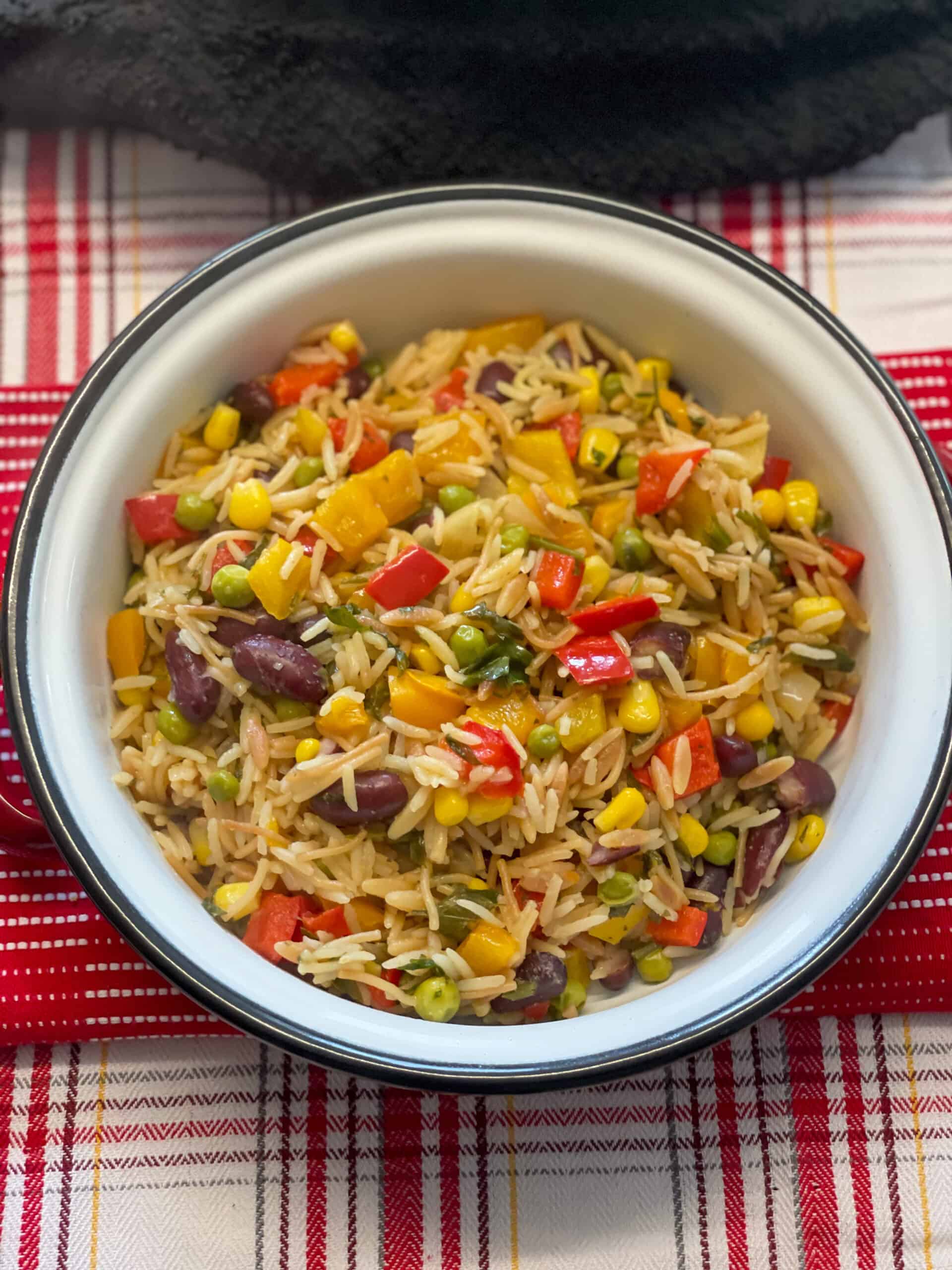 bowl of rice-a-roni with red check background.