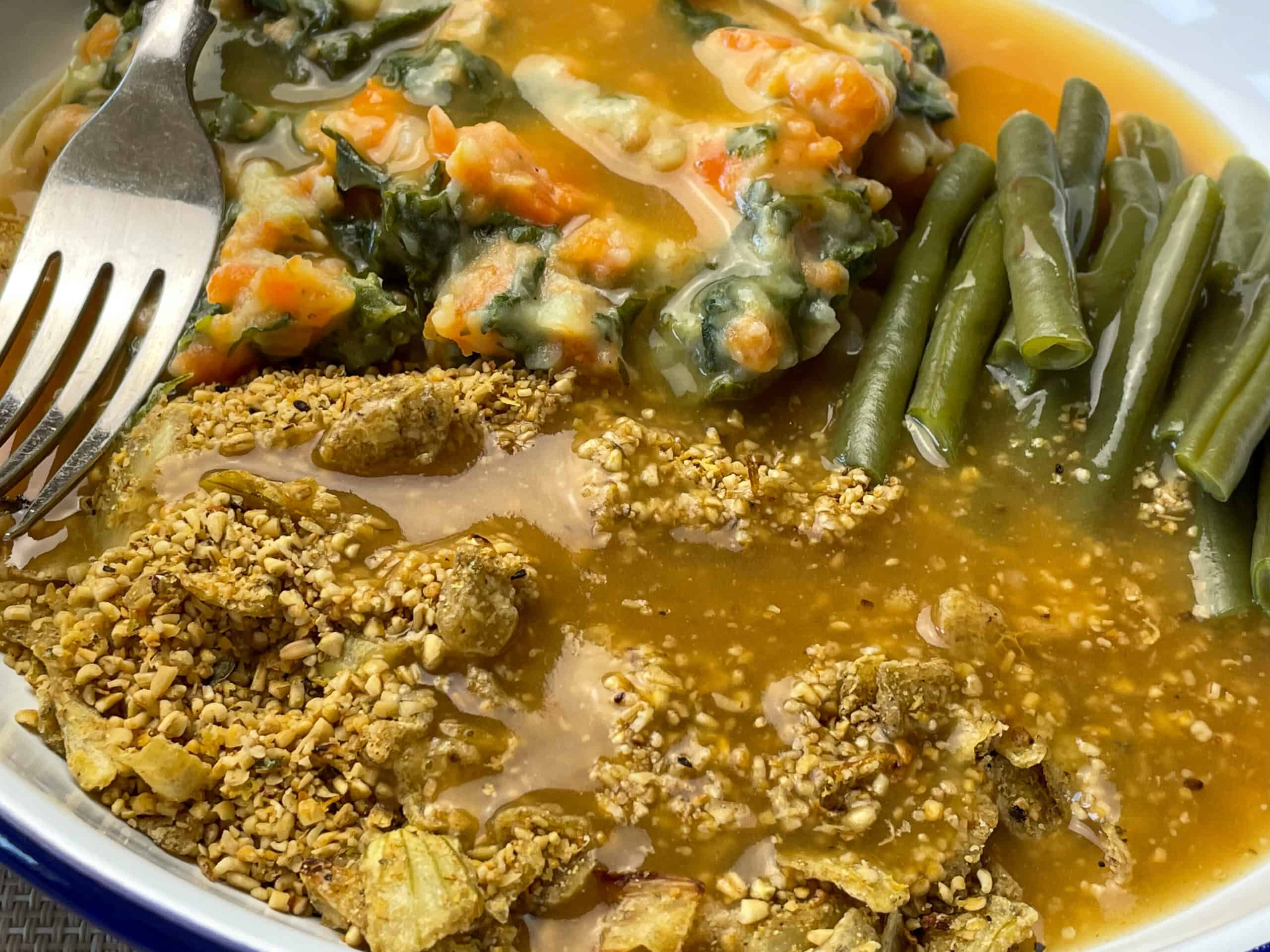 Scottish skirlie with green beans and champ with silver fork.