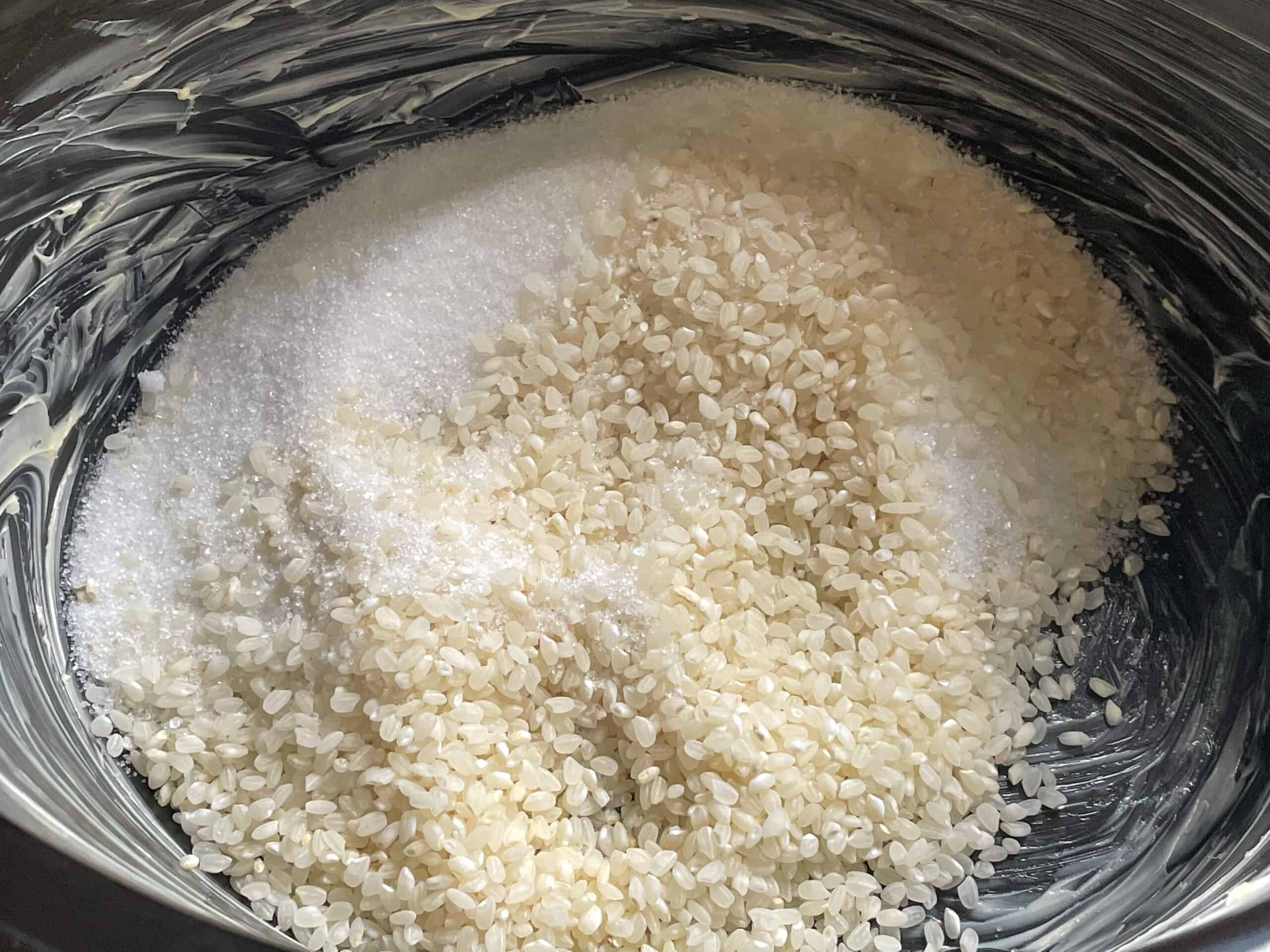 Sugar and rice added to slow cooker.