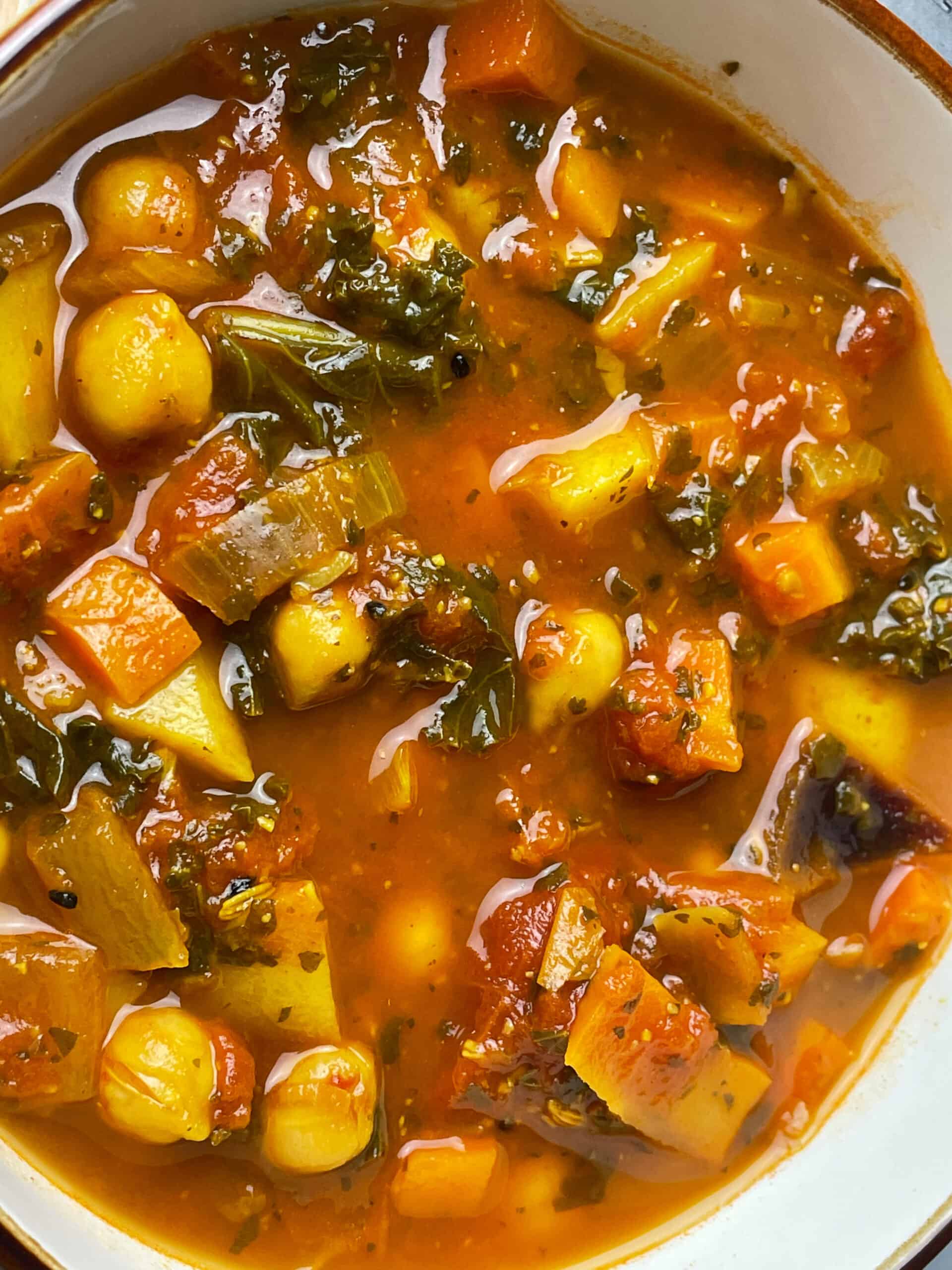 A close up of a bowl of chickpea soup.