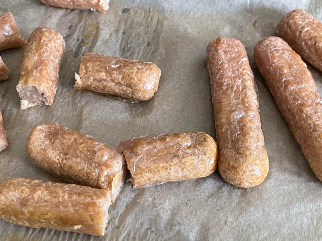 Meat-free sausages cooked and sliced.