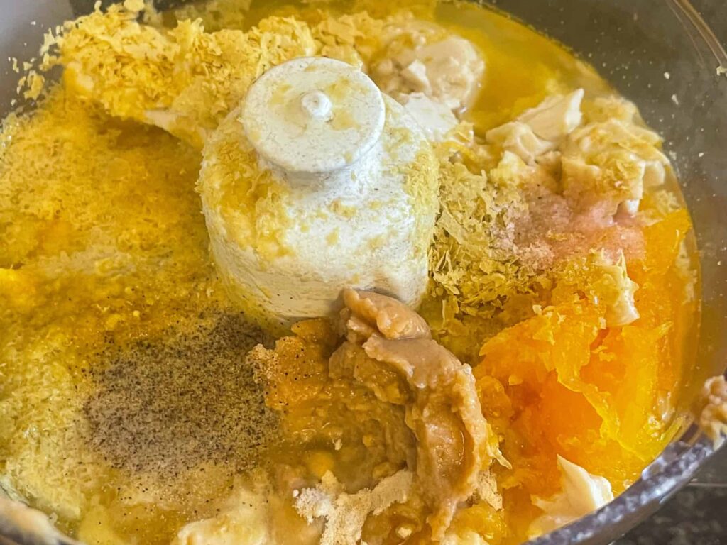 Vegan cheese sauce ingredients in food processor.
