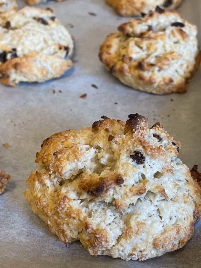 vegan Jamaican coconut rock cakes baked and golden on baking tray.