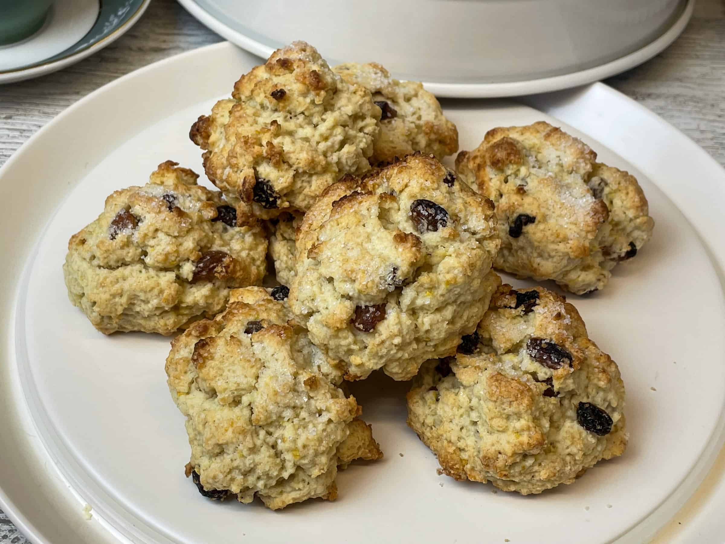 pile of rock cakes on cake tray with lid to side.