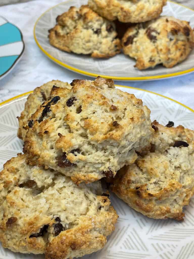 featured image for vegan Jamaican rock cakes close up, 2 plates of buns with third plate to side.