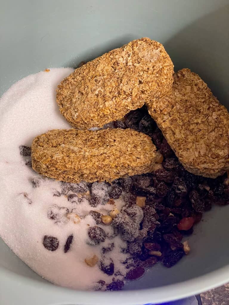 Ingredients for vegan Weetabix loaf cake added to mixing bowl.