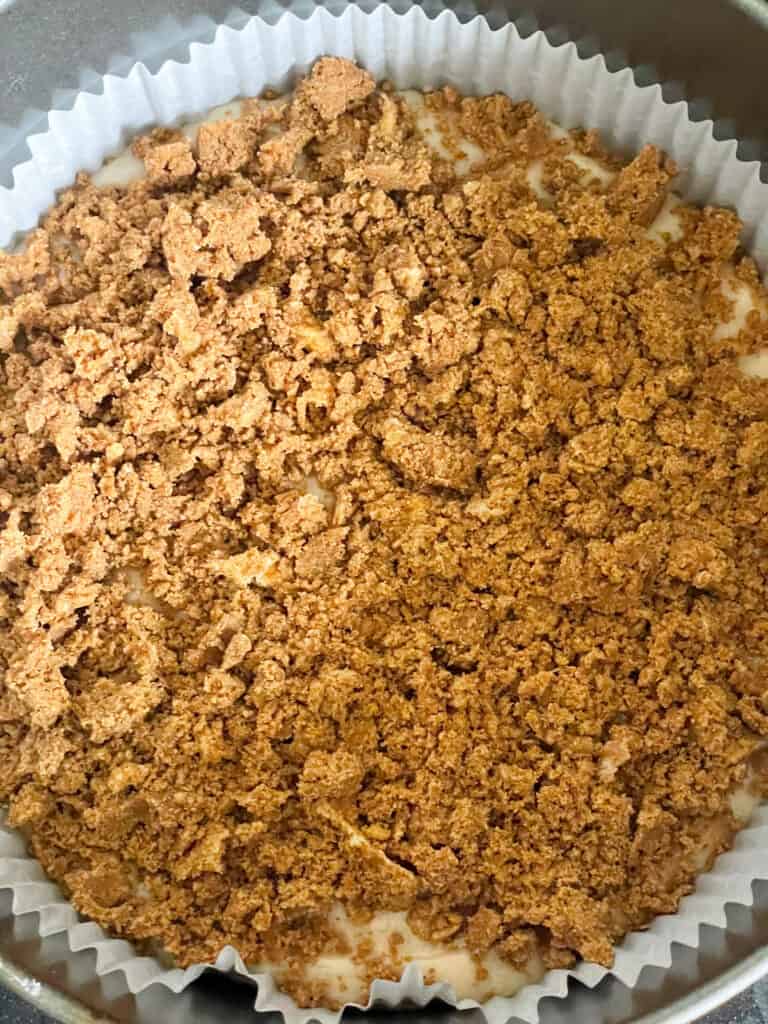 unbaked coffee cake with cinnamon streusel sprinkled over ready to be baked.