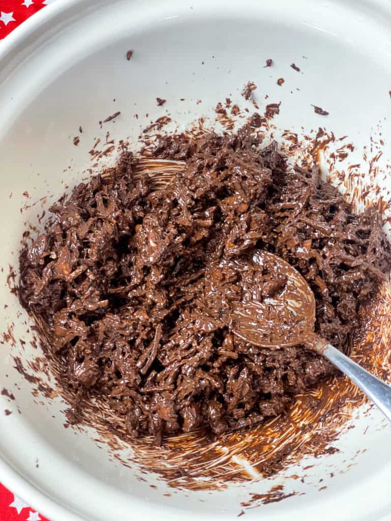ting-a-ling mixture stirred together in mixing bowl with silver spoon.