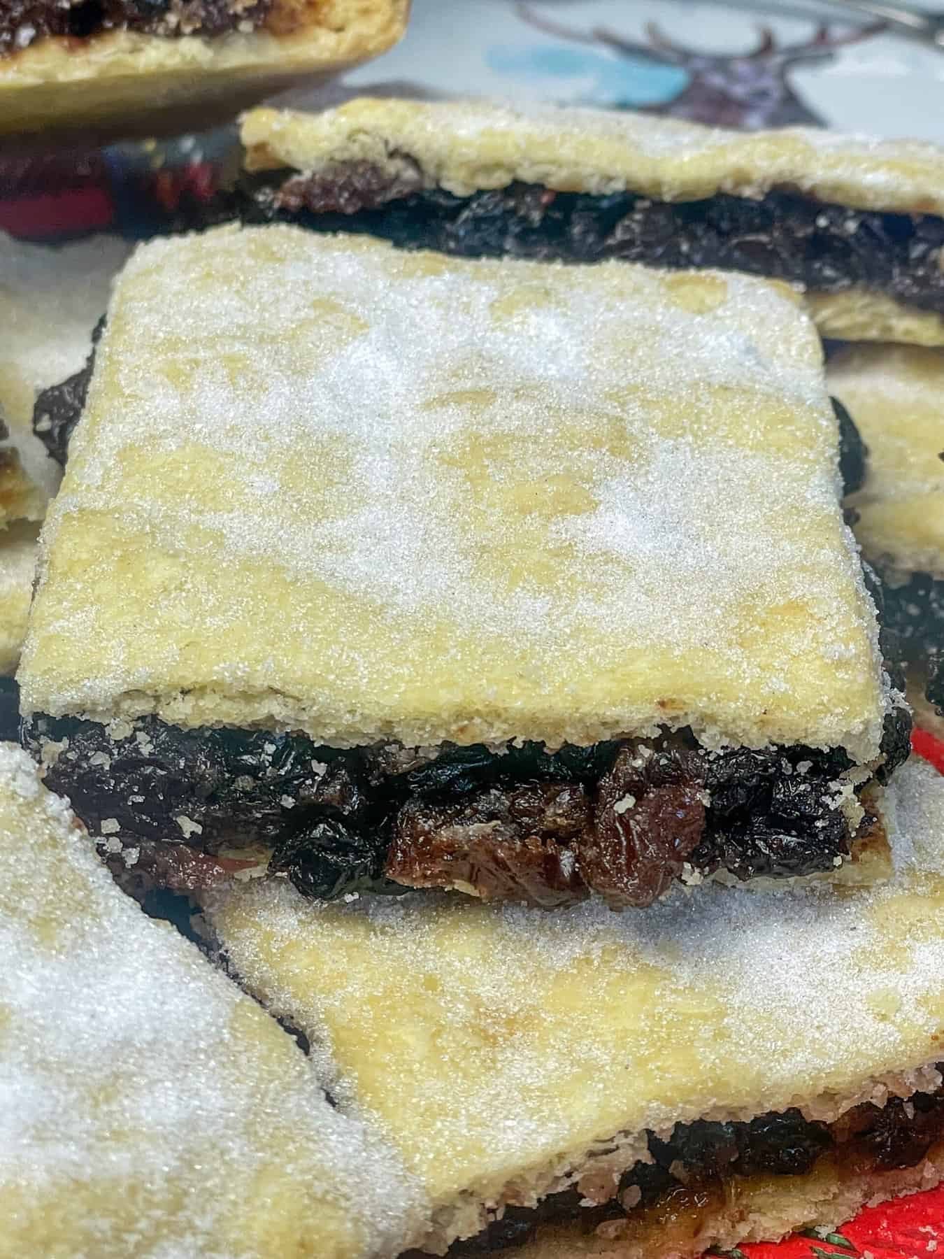 A close up of fruit slice piled on top of another fruit slice.