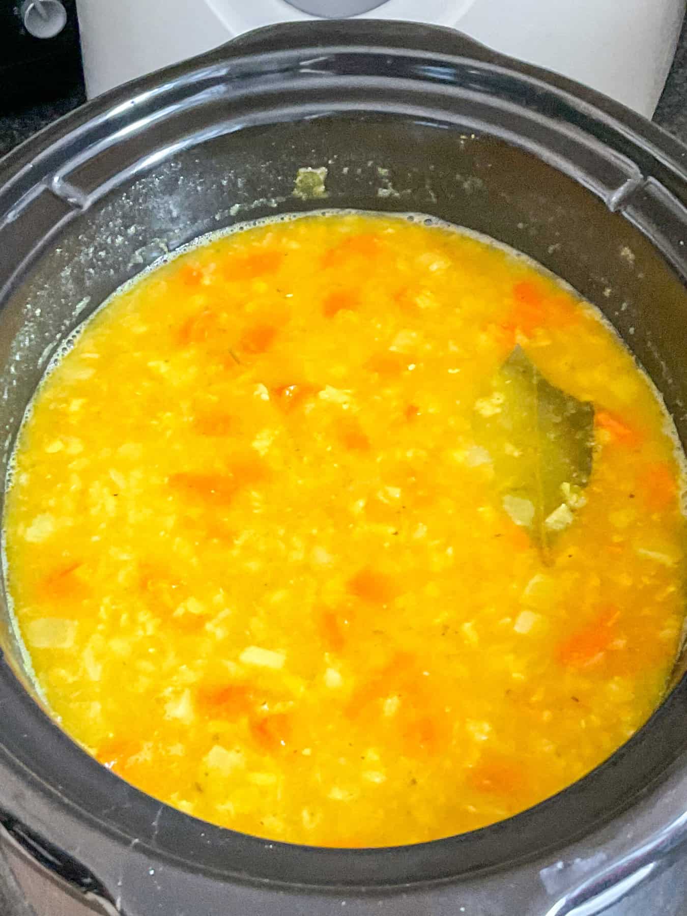Soup stirred and seasoned.