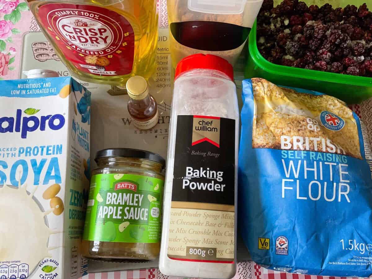 Ingredients for bramble muffins on a cutting board.