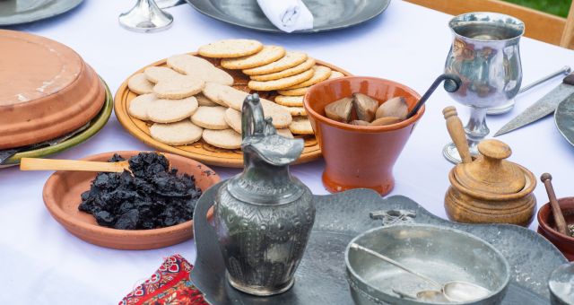 Canva image of a medieval dinner table.
