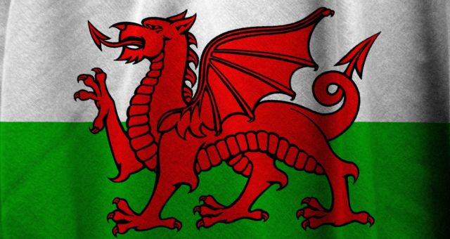 Image of Welsh flag with the red dragon on it, sourced from Canva Pro.