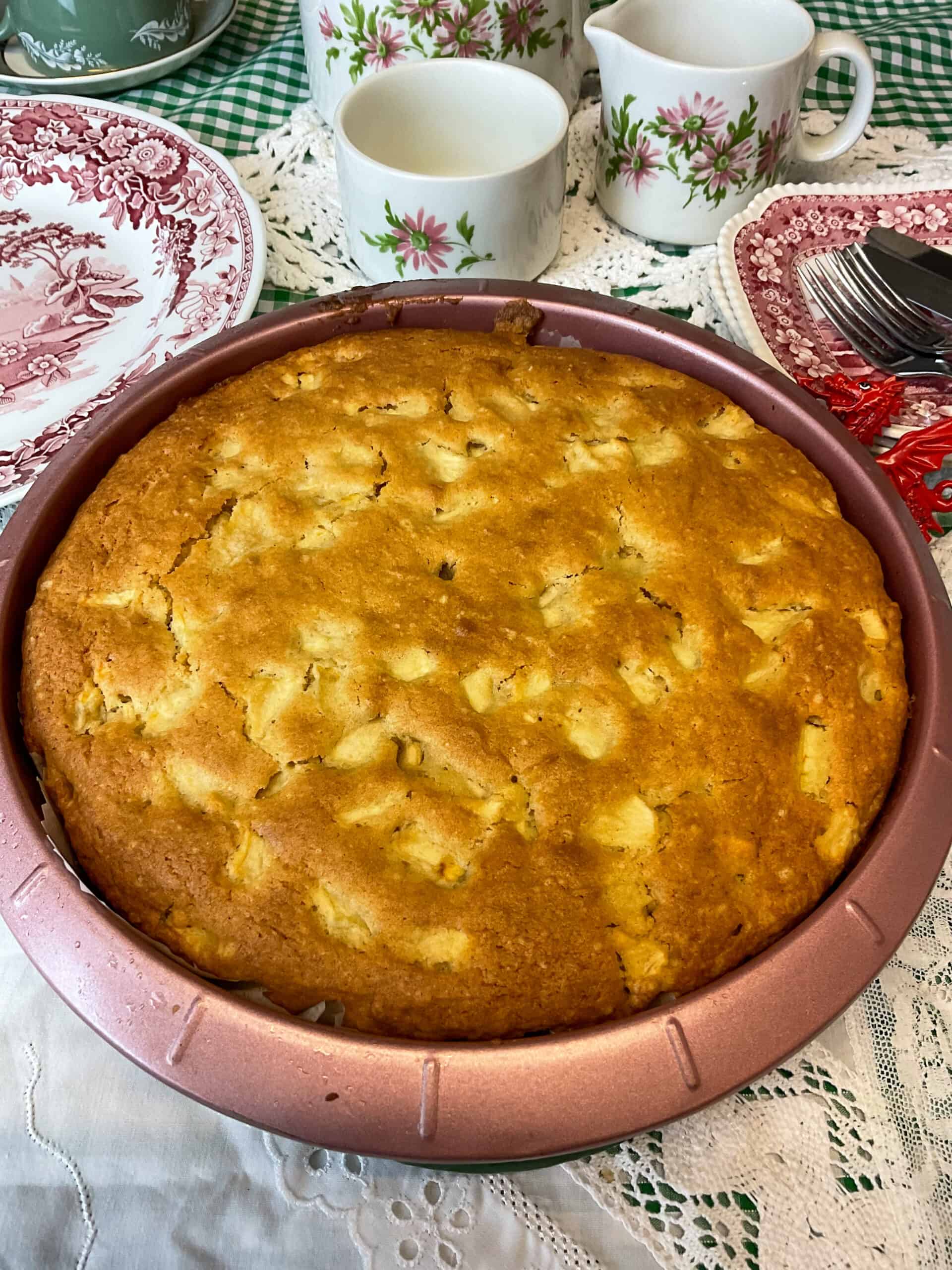 Apple cake baked and still in cake pan.