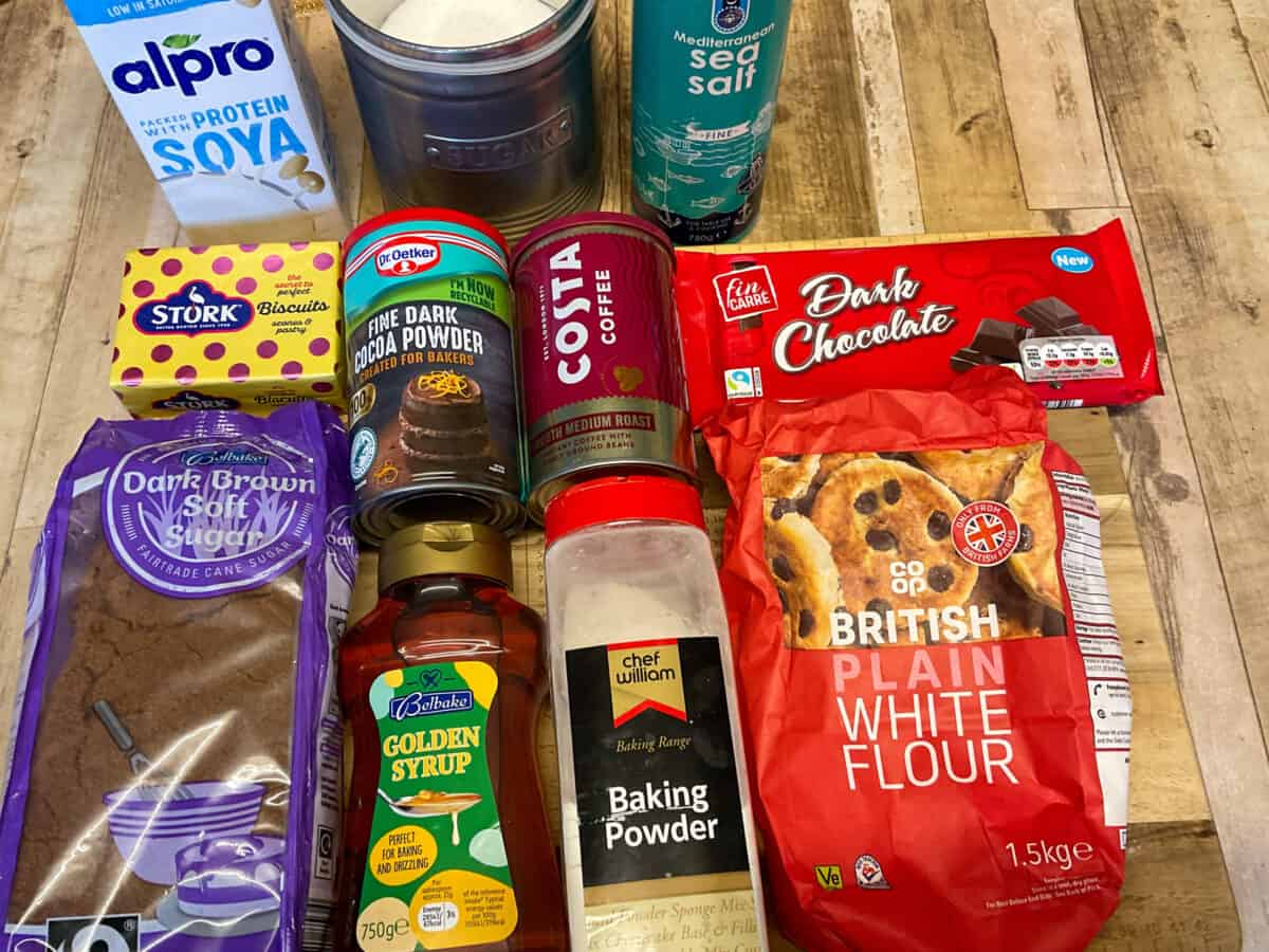 Ingredients for double chocolate chip cookies on a wooden cutting board.