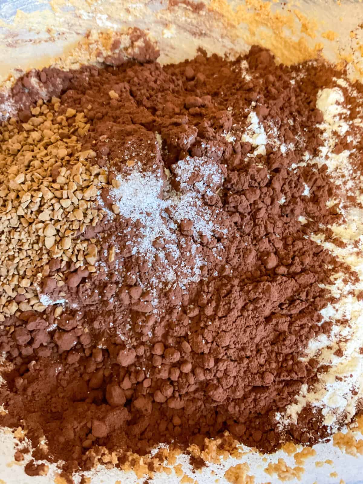 Dry ingredients added to mixture in mixing bowl.