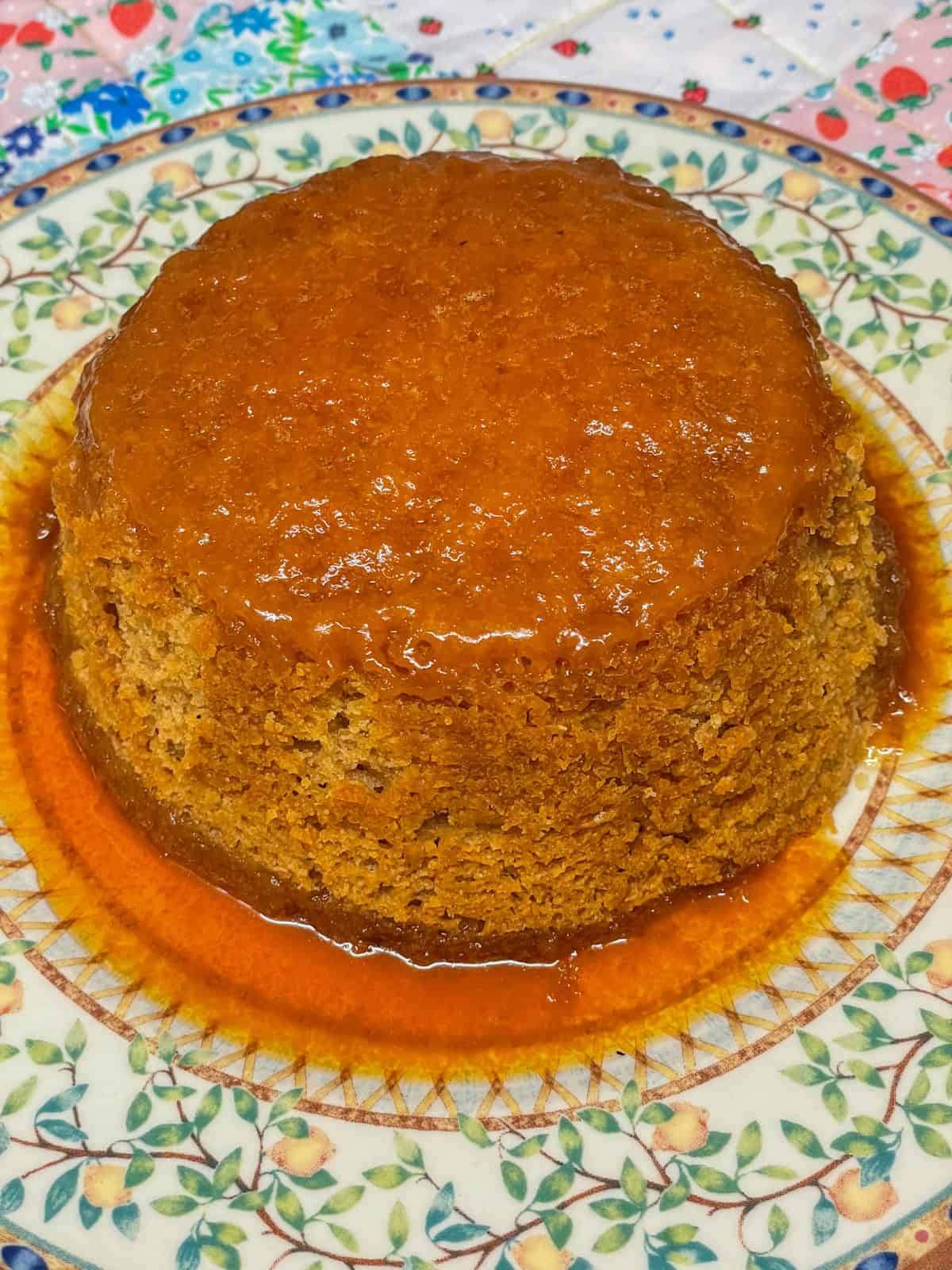 Golden syrup pudding on a plate.