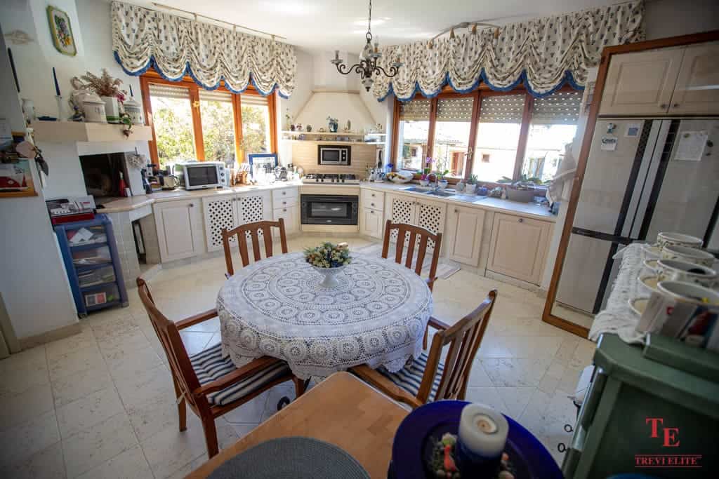 Bright and spacious Italian kitchen with traditional decor, decorative curtains, wooden furniture, and modern appliances, perfect for comfortable family living.