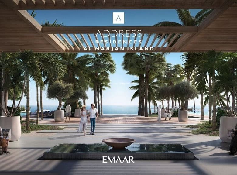 Vibrant beachfront promenade with palm trees and modern seating areas, perfect for relaxing and enjoying the ocean views on Al Marjan Island.