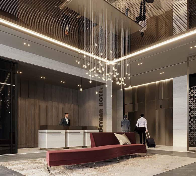 Luxurious hotel lobby with modern design, stylish velvet sofa, sleek reception desk, and artistic lighting fixture, creating an elegant and welcoming atmosphere for guests.