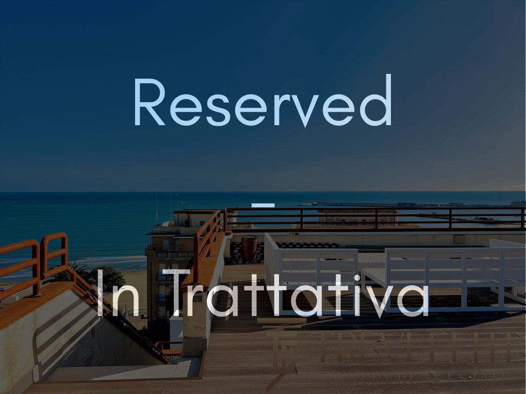 Reserved "In Trattativa" sign over a luxury rooftop terrace with a sea view