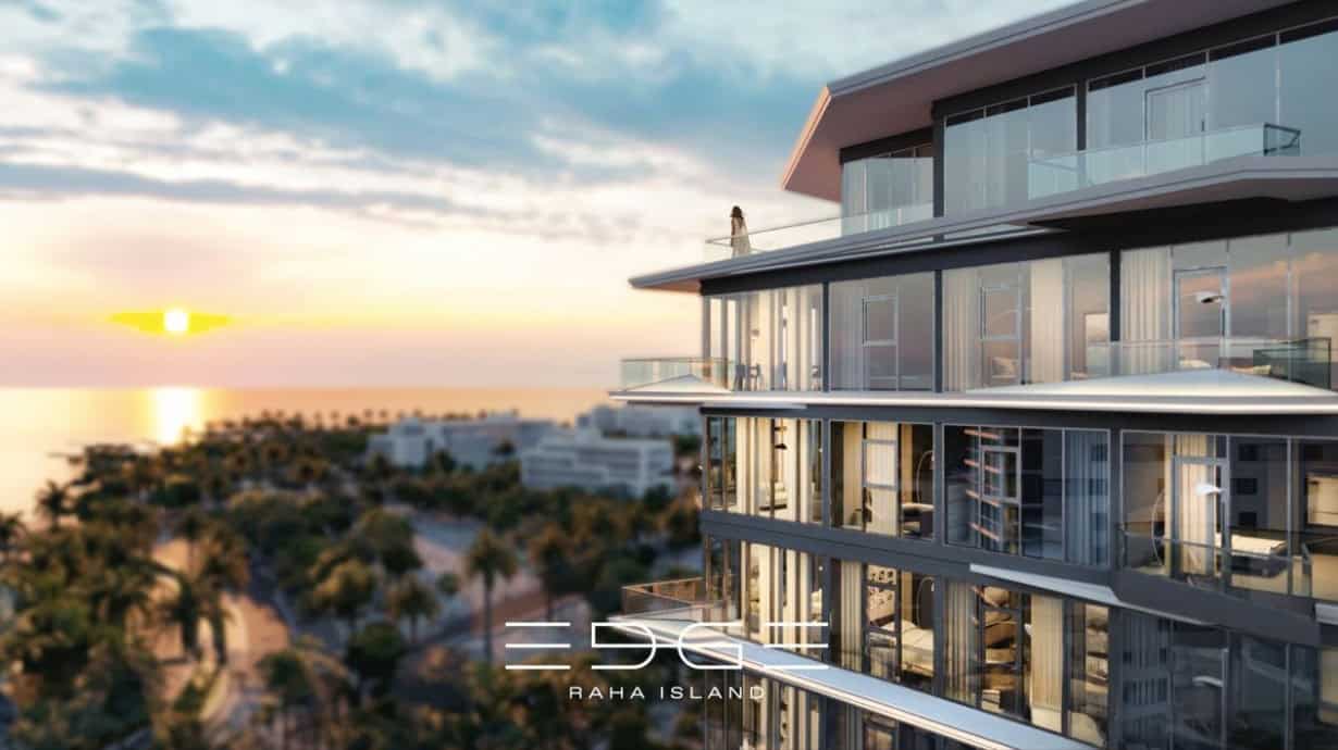 Luxurious modern residential building with panoramic sea views at sunset on Raha Island, showcasing sleek architecture and elegant outdoor spaces for high-end living.