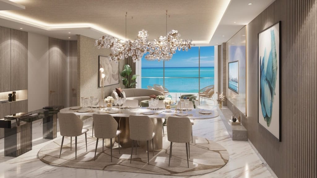Luxurious modern dining and living room with ocean view, elegant decor, and contemporary art in a high-end Italian real estate property.