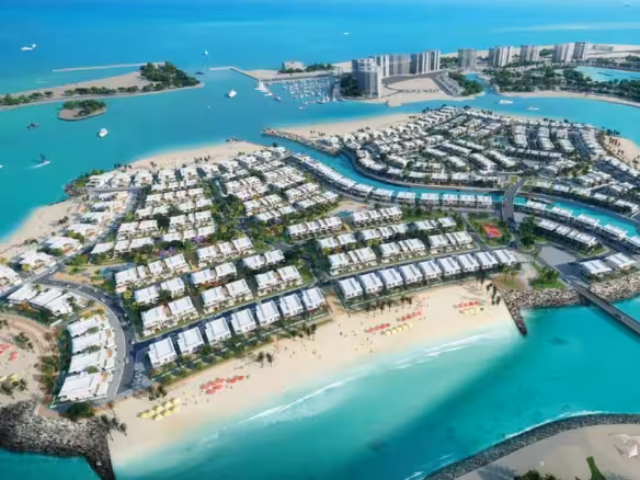 Aerial view of luxurious waterfront resort with boats.