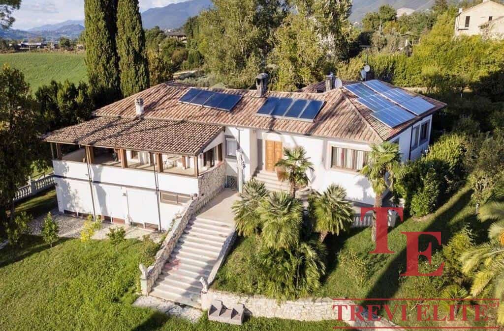 Elegant Italian villa with solar panels, lush landscaped gardens, and panoramic mountain views – a luxurious retreat for discerning buyers.