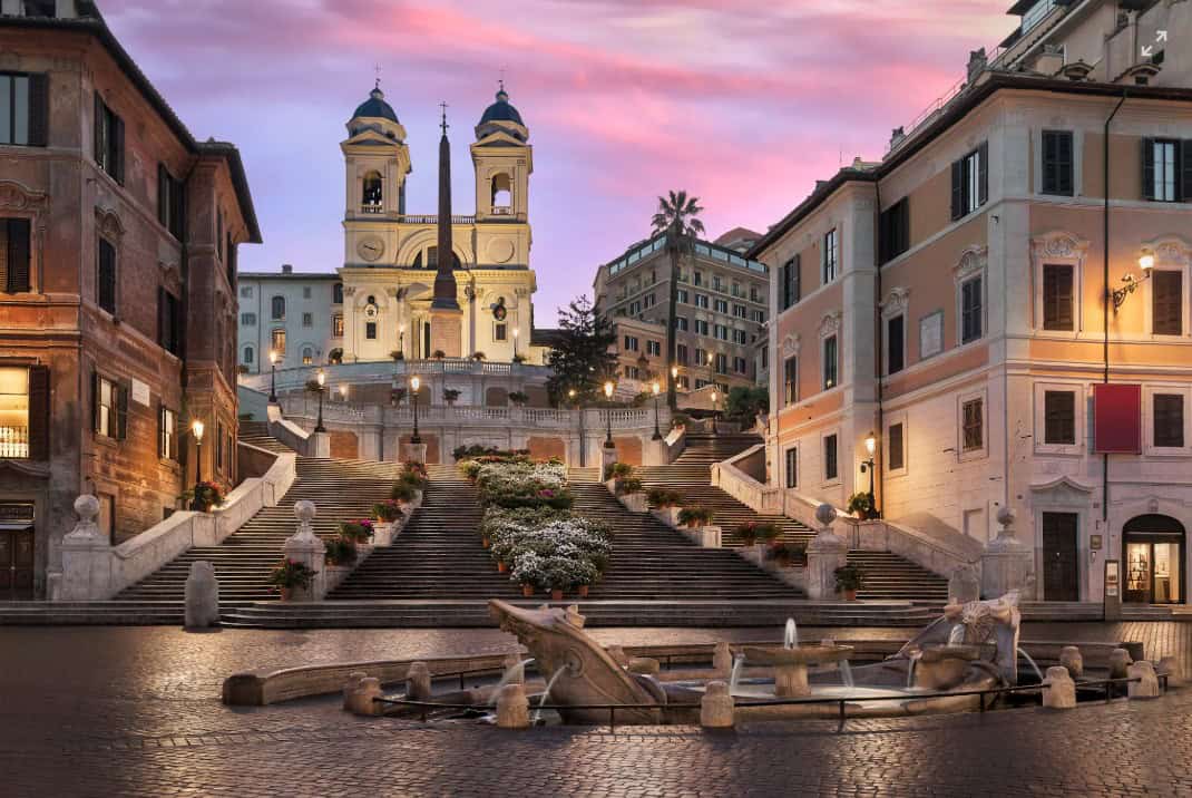 Elegant Rome Trevi Fountain at sunset with historic architecture and romantic atmosphere, ideal for luxury Italian real estate and living.