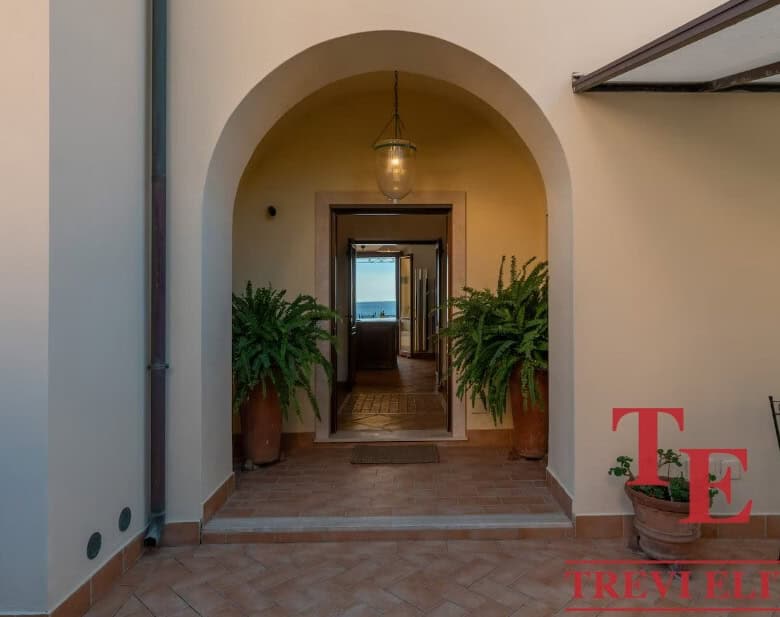 Luxurious Italian interior with classic arches and elegant decor, perfect for upscale real estate listings in Italy.