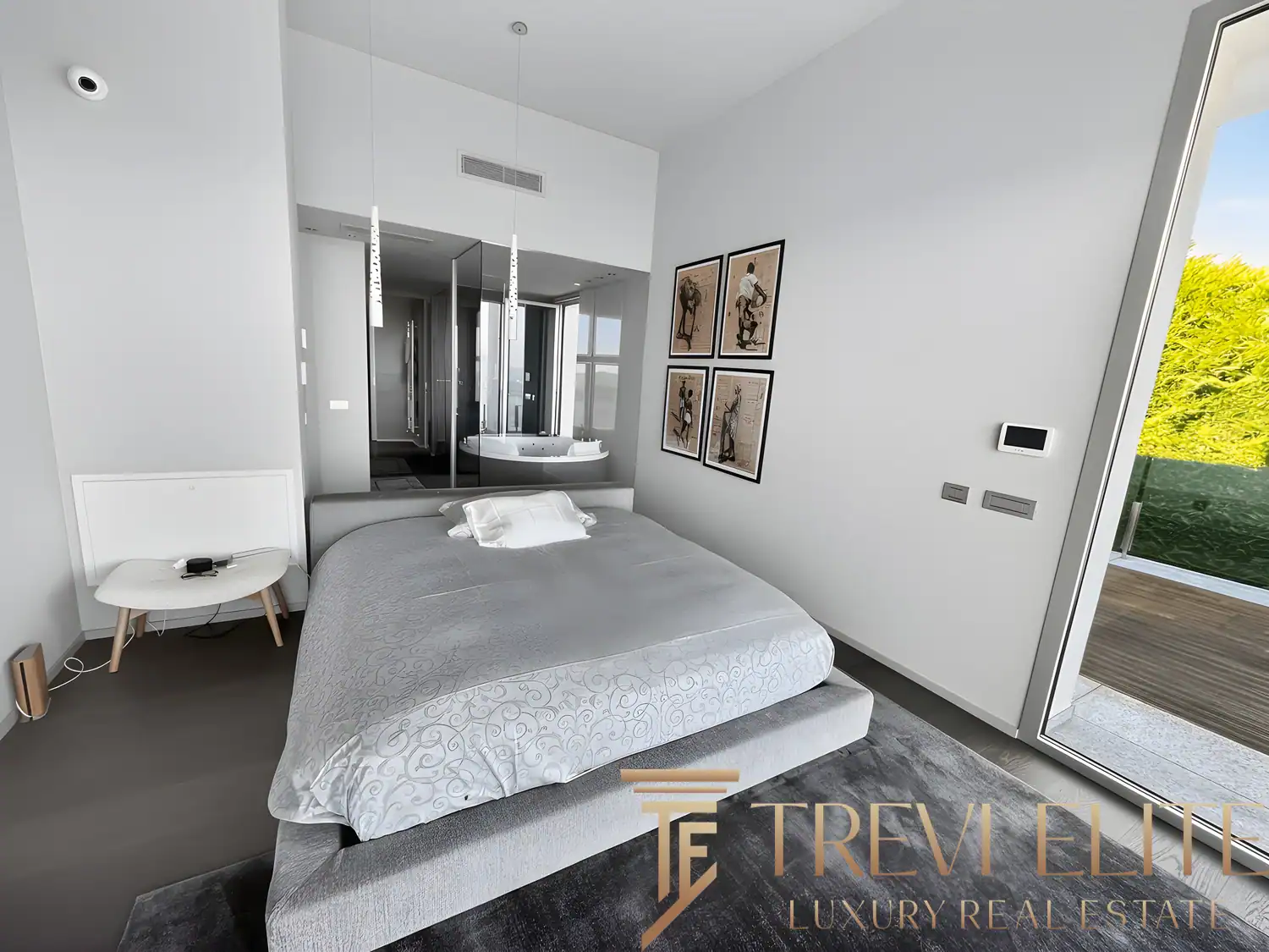 Bright contemporary bedroom with sleek white walls and direct terrace access.