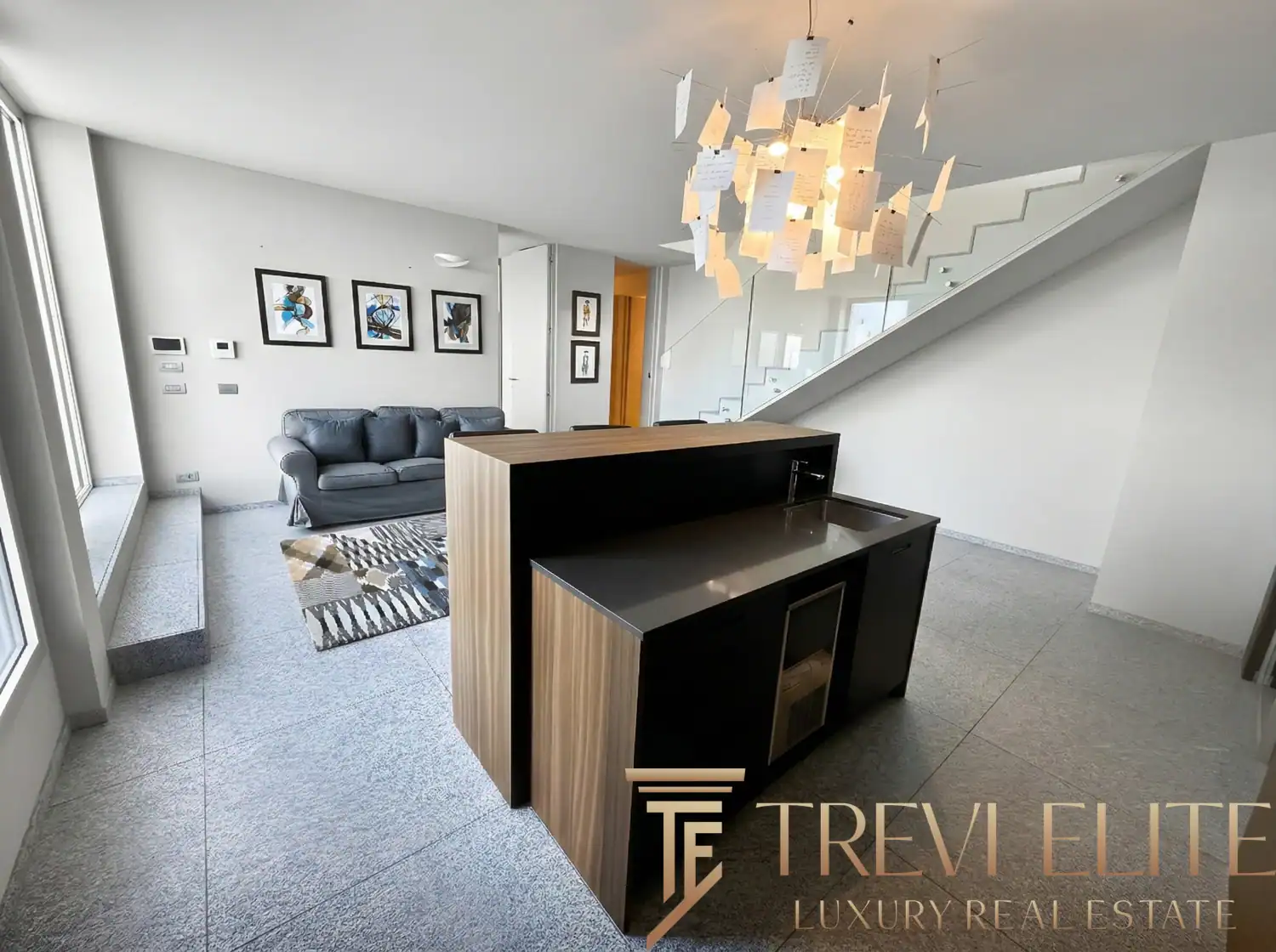 View of the stairs and a minimalist wooden room divider.