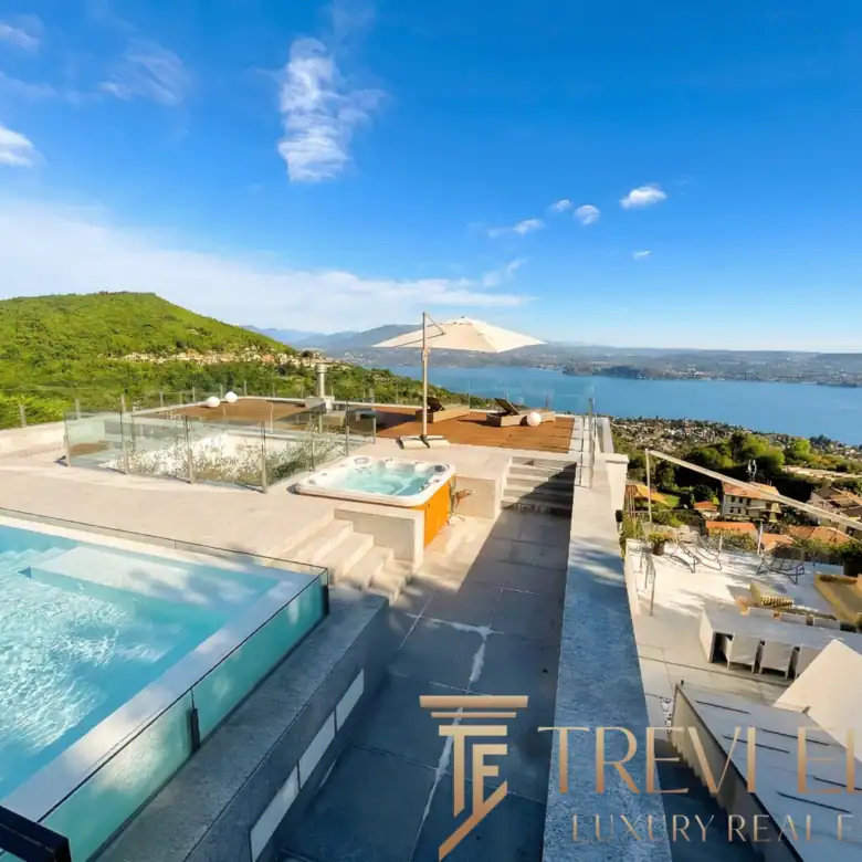 Wide shot of the infinity pool overlooking the blue waters of Lake Maggiore.