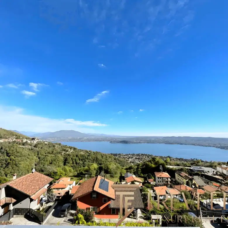 Aerial-style view of the villa’s red-tiled roof and the surrounding "Vergante" hills.