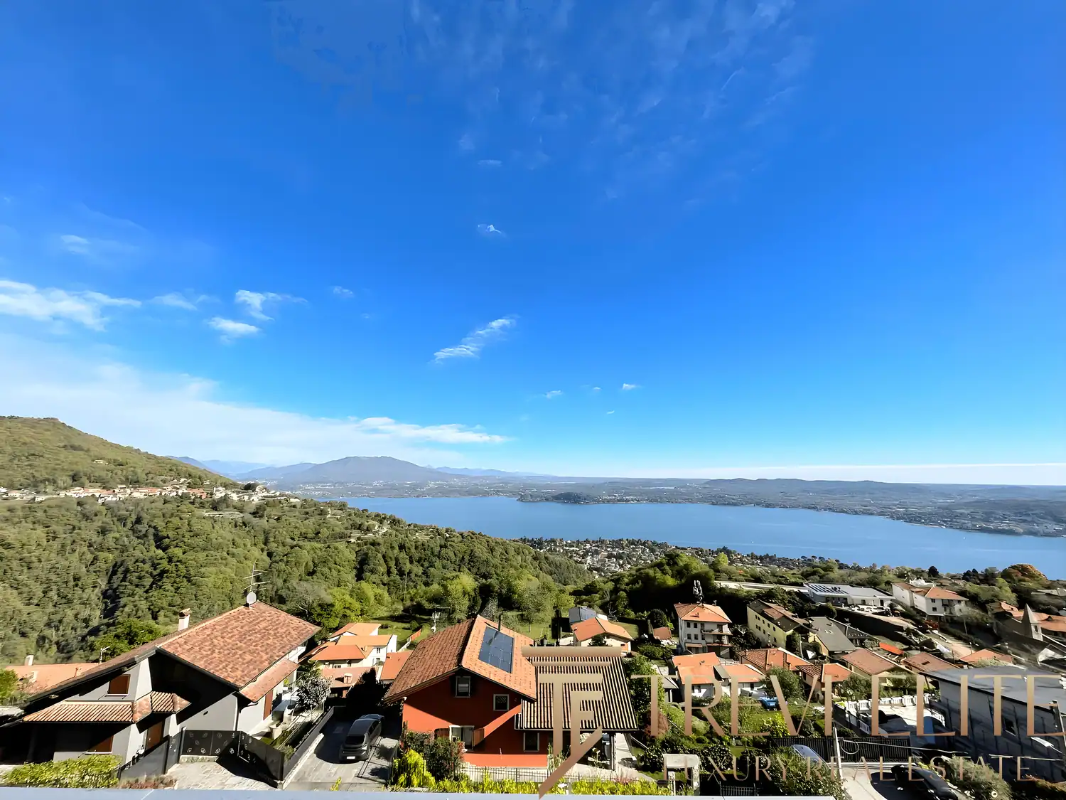 Aerial-style view of the villa’s red-tiled roof and the surrounding "Vergante" hills.