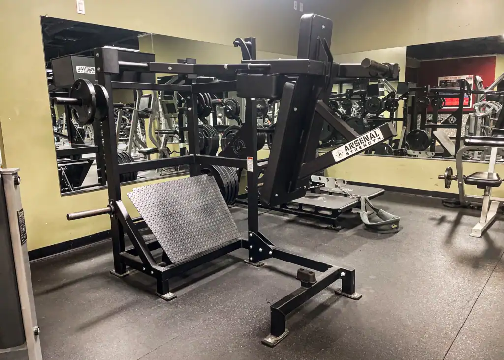 Arsenal Strength leg press and hack-squat combination machine at Triangle Fitness.