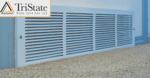 Wall-Mounted Air Vent Above Carpeted Floor With Tristate Home Services Llc Logo In The Corner.