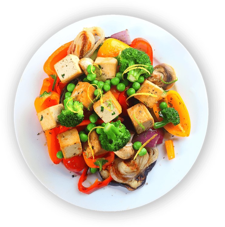 Crispy tofu vegetable stir-fry with broccoli, bell peppers, mushrooms, and peas on a white plate healthy vegan recipe.