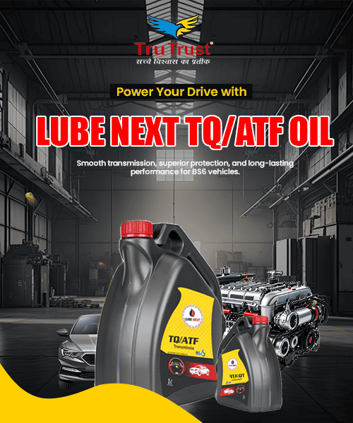 Lube next TQ/ATF oil bottles in an automotive workshop setting, showcasing quality transmission fluids.
