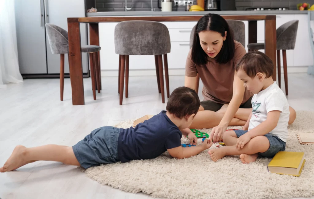 woman playing with children