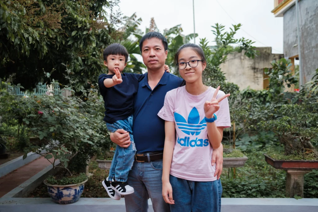 a family posing at the camera