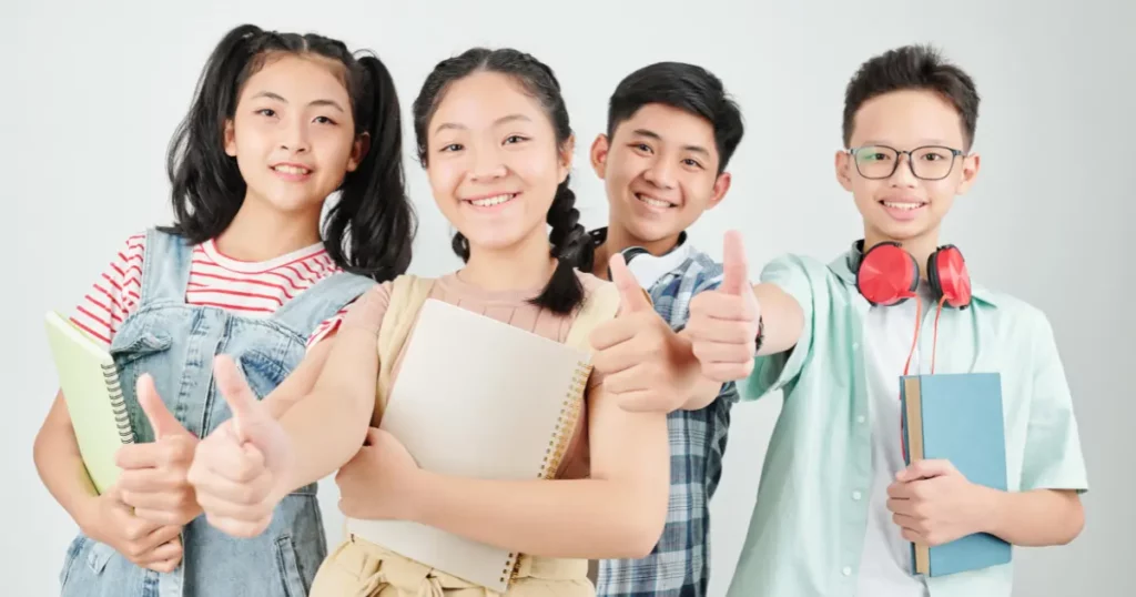 a group of students giving thumbs up | tuitioncentre SG