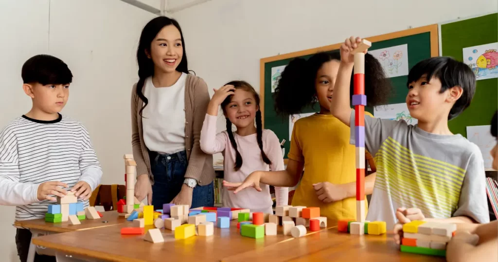 a group of children playing with blocks in a classroom