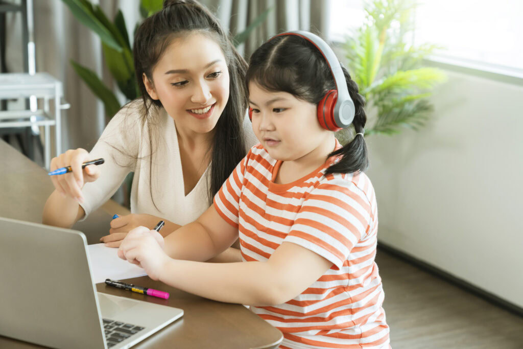 Asian mother enjoy teach and explain homework to child daughter | Tuition Centre SG