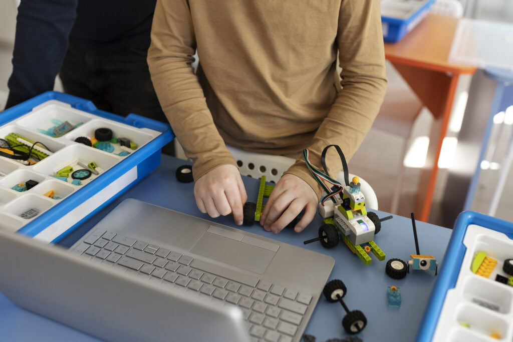 Kid building a robot using electronic parts | Tuition Centre SG