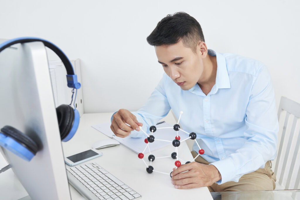 Asian man working on project | Tuition Centre SG