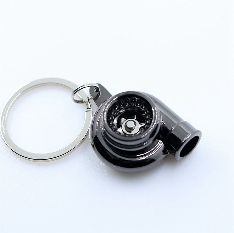 Black full metal TURBOOST spinning turbo keychain (KM9003) with visible impeller and keyring.